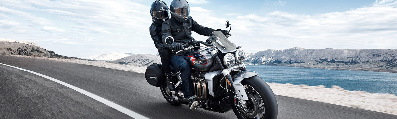 A couple trailing through the scenic route on a 2020 Triumph Rocket 3 motorcycle.